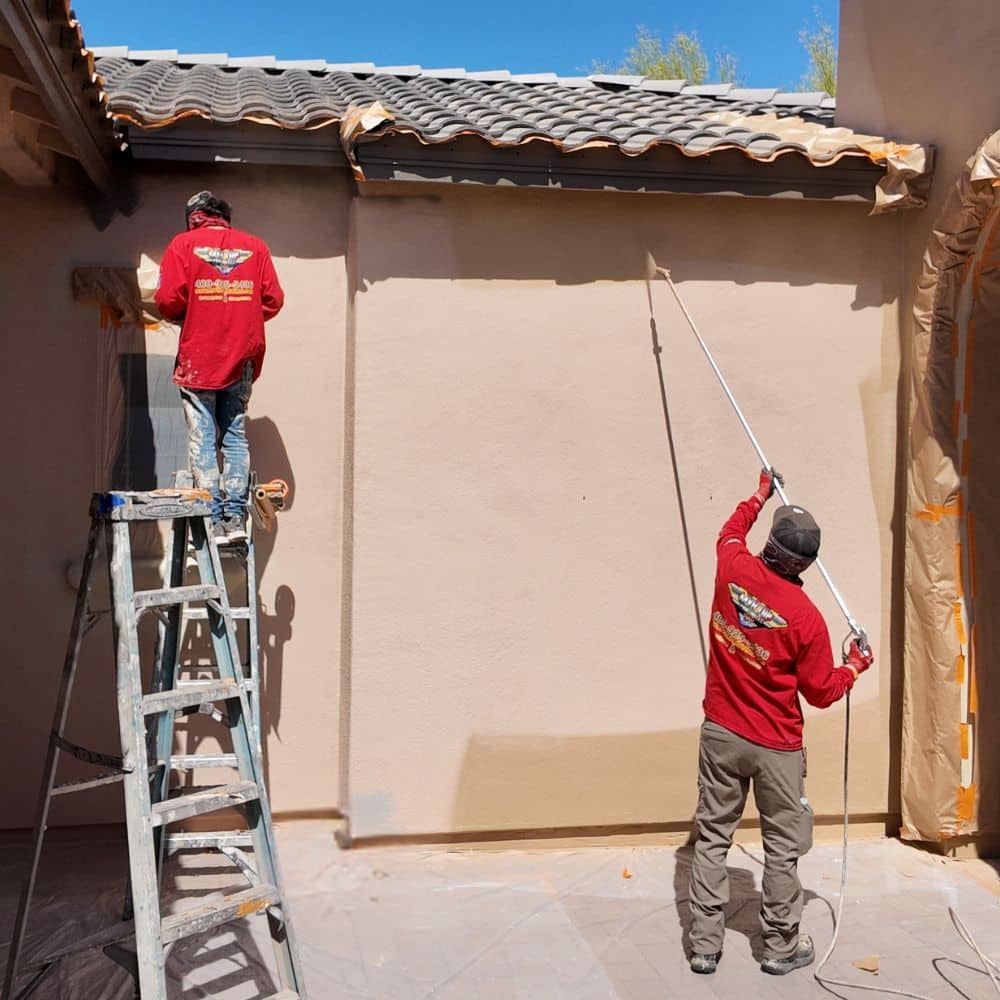Workers from our painting company handling an exterior painting job.
